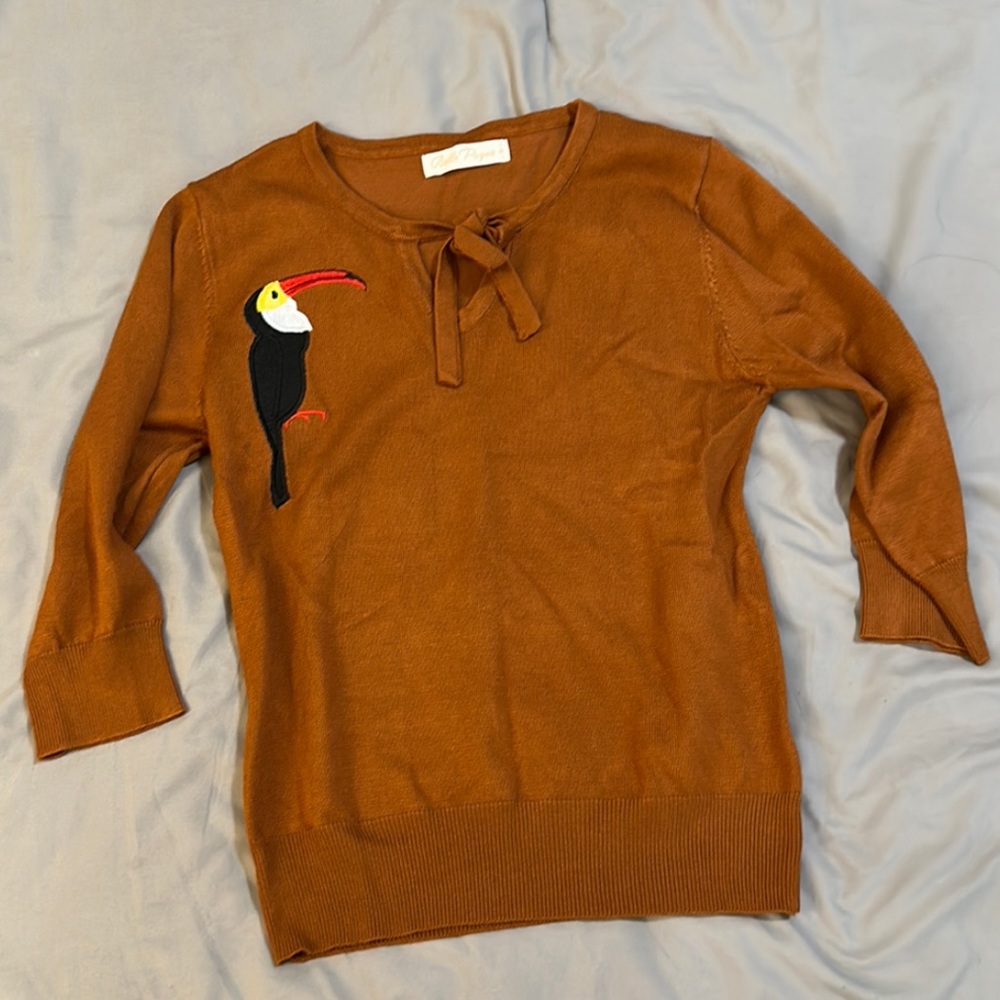 Women’s sweater top. Three quarter length sleeves. Retro, 50’s, vintage style.